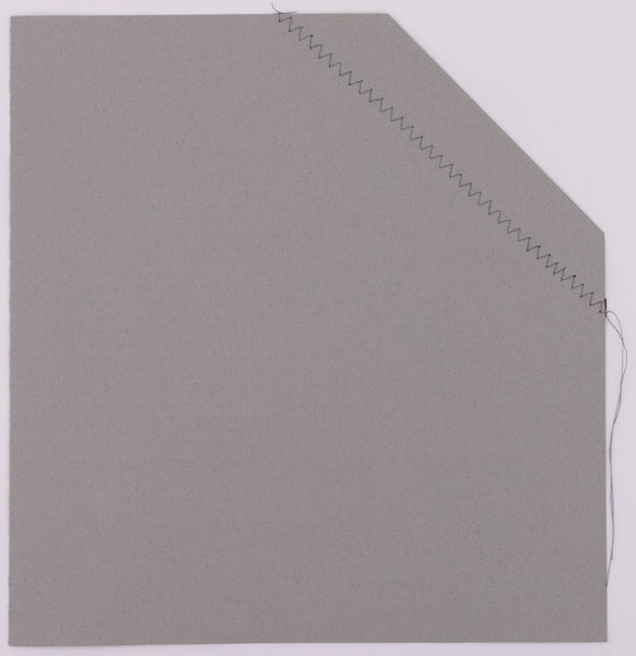 The back side of the broadside. Grey paper