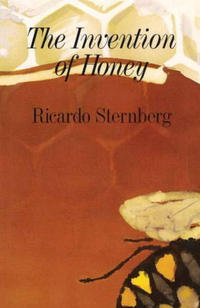 Cover of the book titled The invention of honey by Ricardo Sternberg. On the cover is a illustration of honey comb. Towards the top you can see the honey comb easily since it is in a light yellow and white but most of the cover in in a amber like color representing honey that only lets you see a light outline of the honey comb. In the bottom right corner you can see the bottom half of a black and yellow bee. The text is in black.